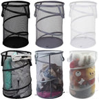 Foldable mesh laundry hamper with handles, 75L, in bedroom setting